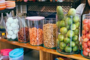 Green and Brown Fruit on Clear Plastic Container