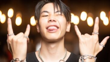 Portrait of a Young Man Wearing Lots of Jewellery