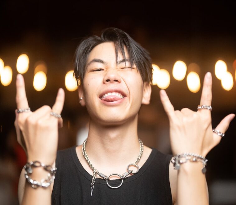 Portrait of a Young Man Wearing Lots of Jewellery