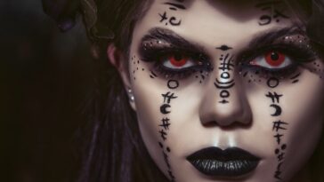 Spooky woman with makeup of spells