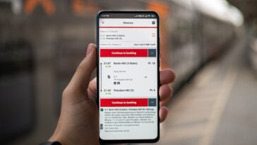 person holding silver iphone 6