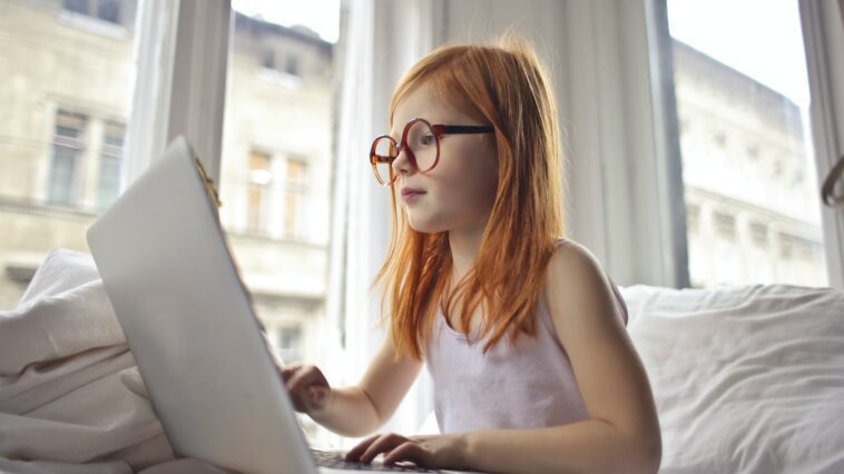 A Girl Watching Movie On Computer Laptop