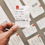 person holding white card