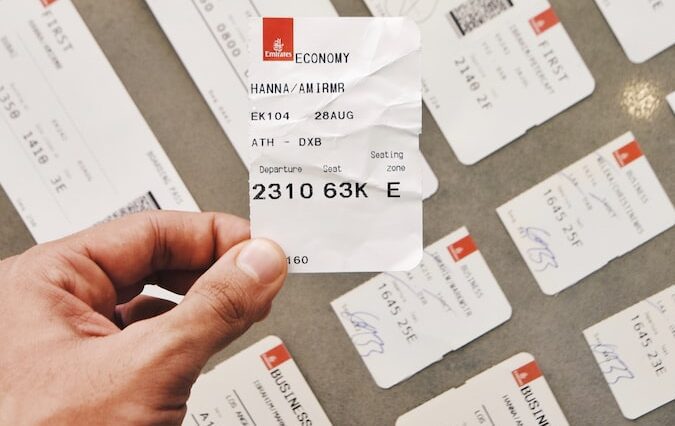 person holding white card