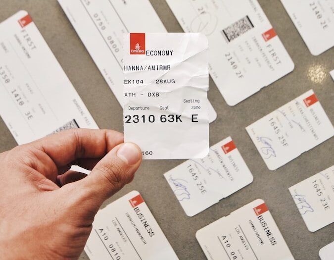 person holding white card