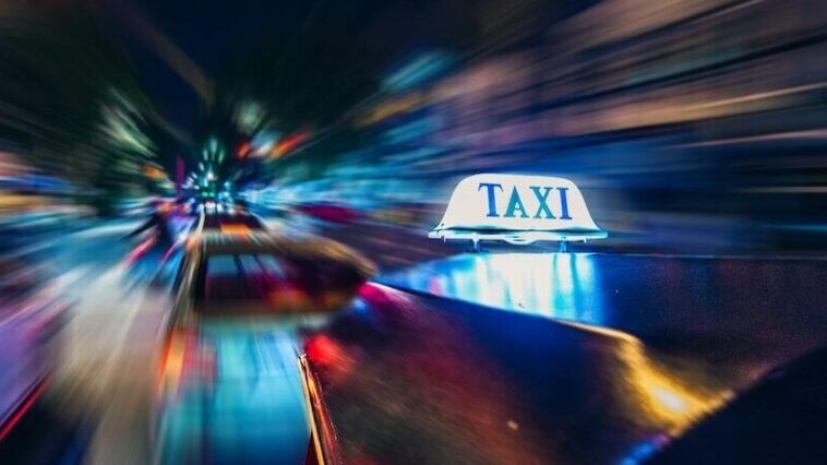 yellow taxi time lapse photography