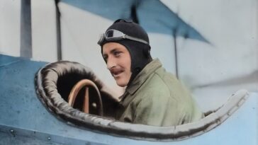 man inside biplane