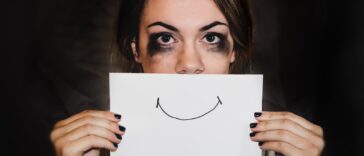 person holding white printer paper