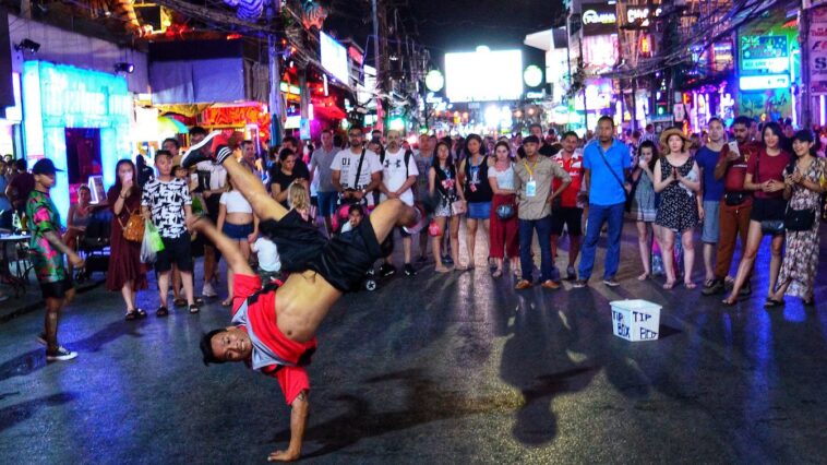 a group of people walking down a street