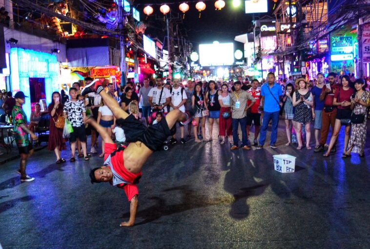 a group of people walking down a street
