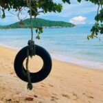 a swing on a beach