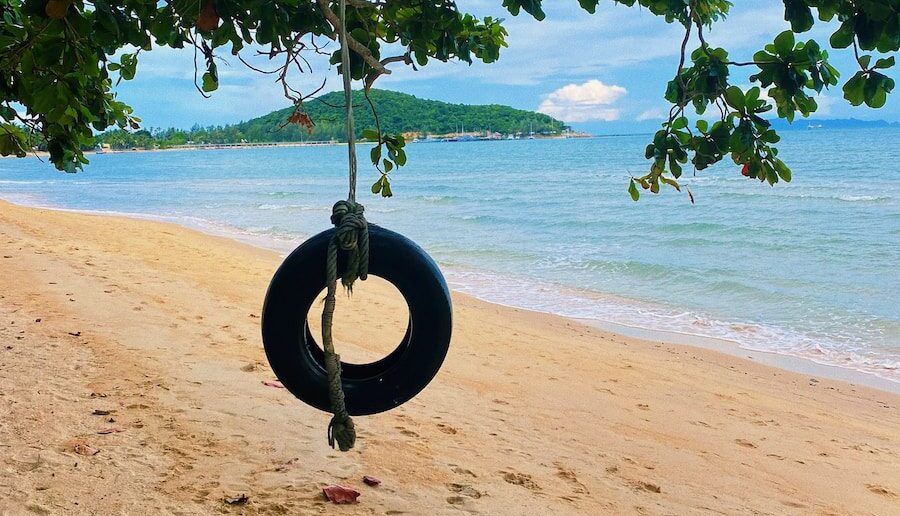 a swing on a beach